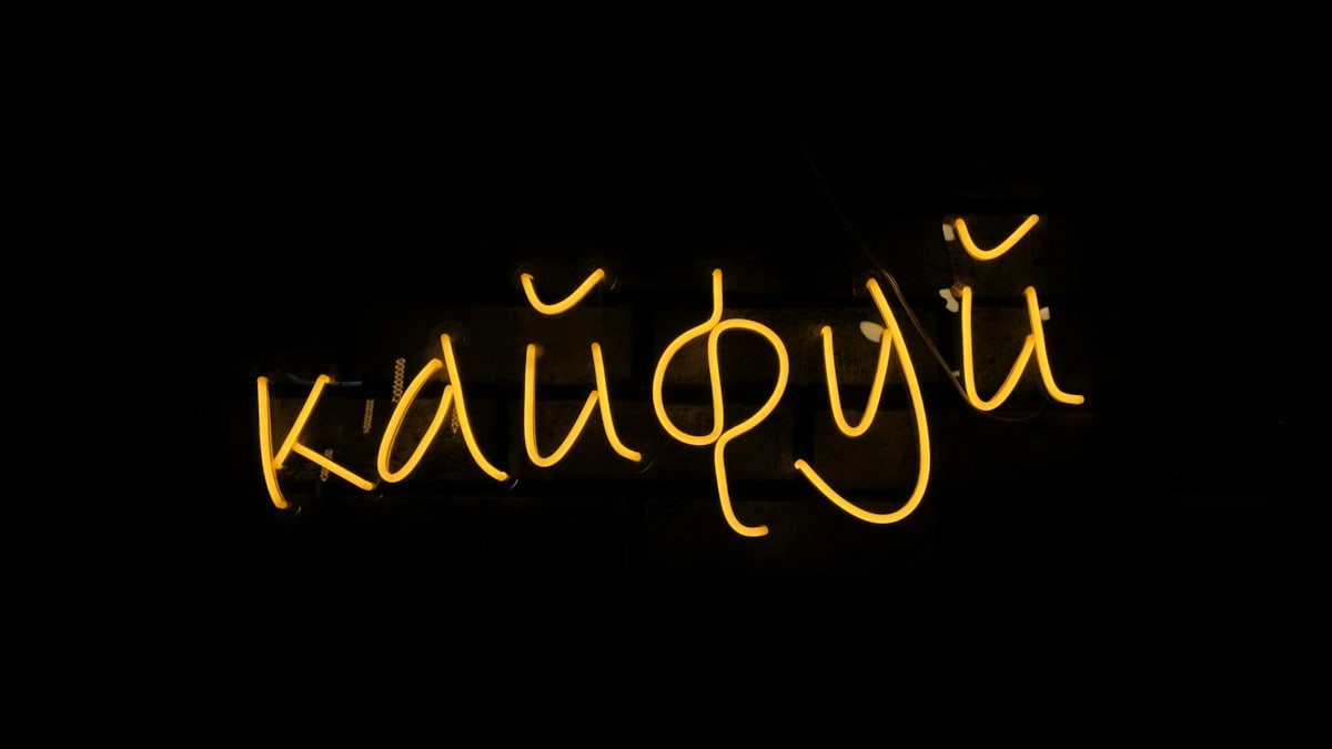 a neon sign that says kaupyi on it